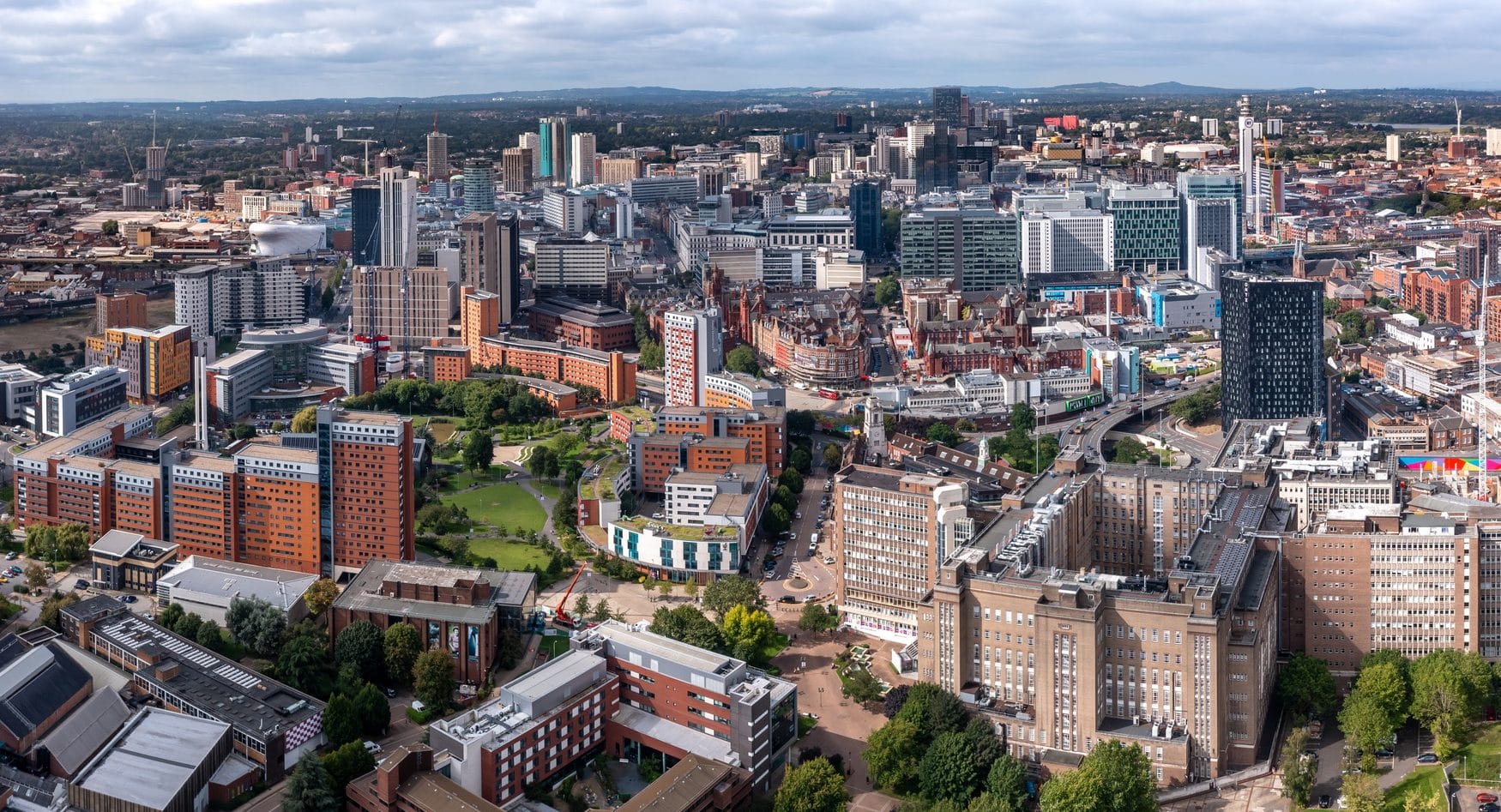 Aerial view of a Birmingham cityscape skyline with city centre prominent