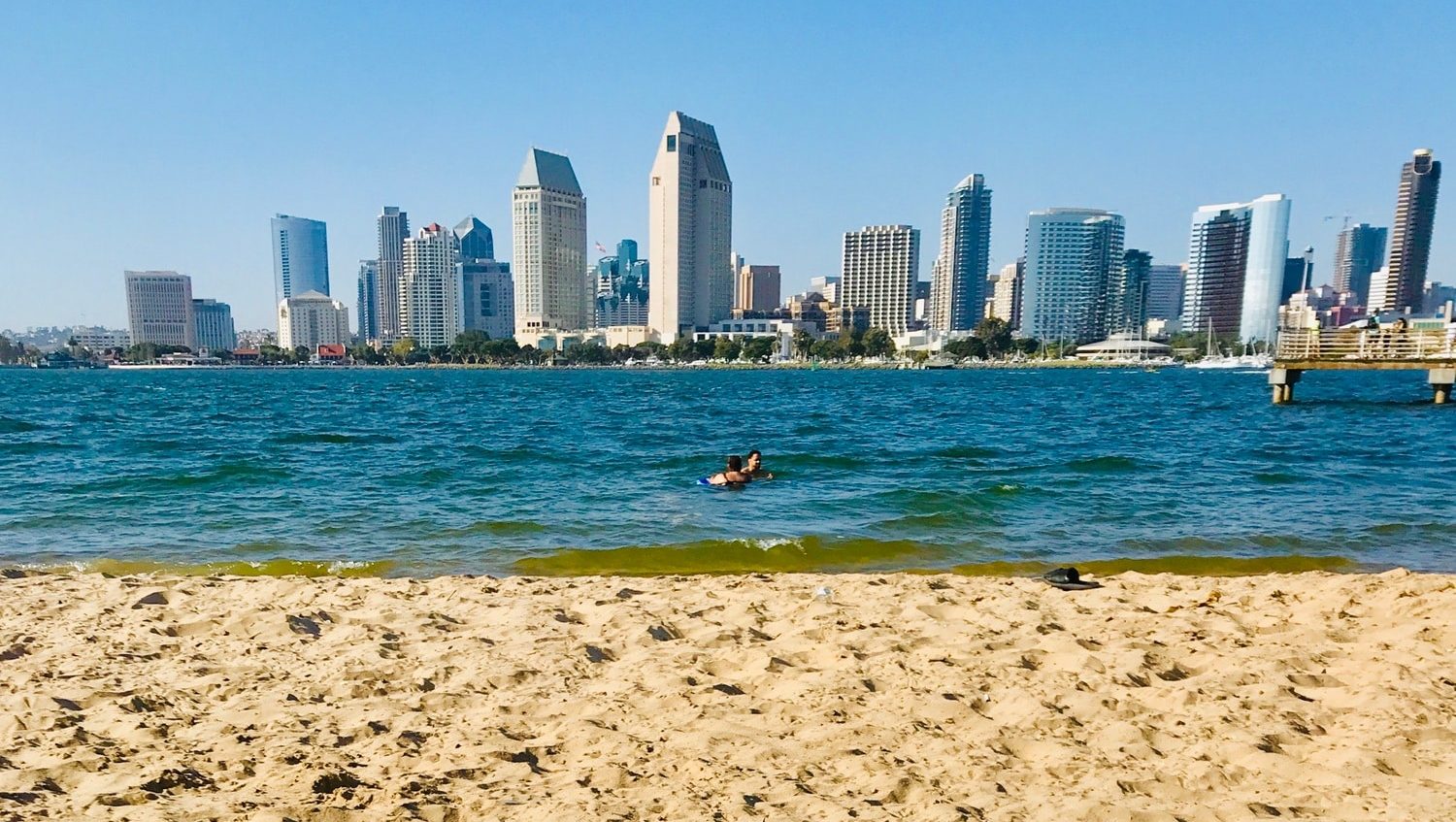 Relaxing on the sand looking at the ocean and the San Diego skyline
